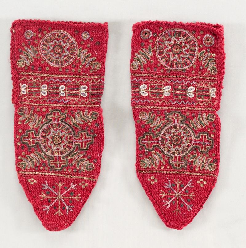 A pair of richly embroidered red historic socks